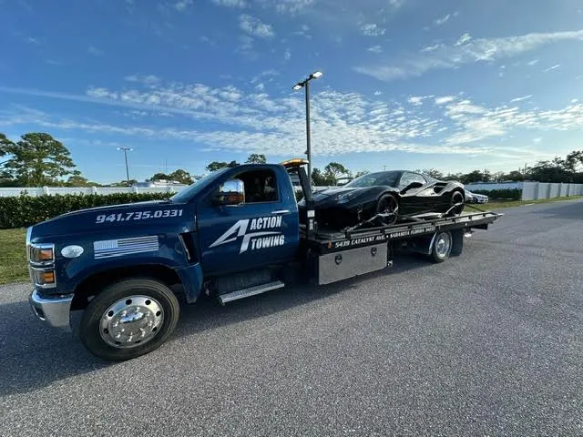 Navy Action Towing flatbed carrying a sports car, ready for a long-distance run